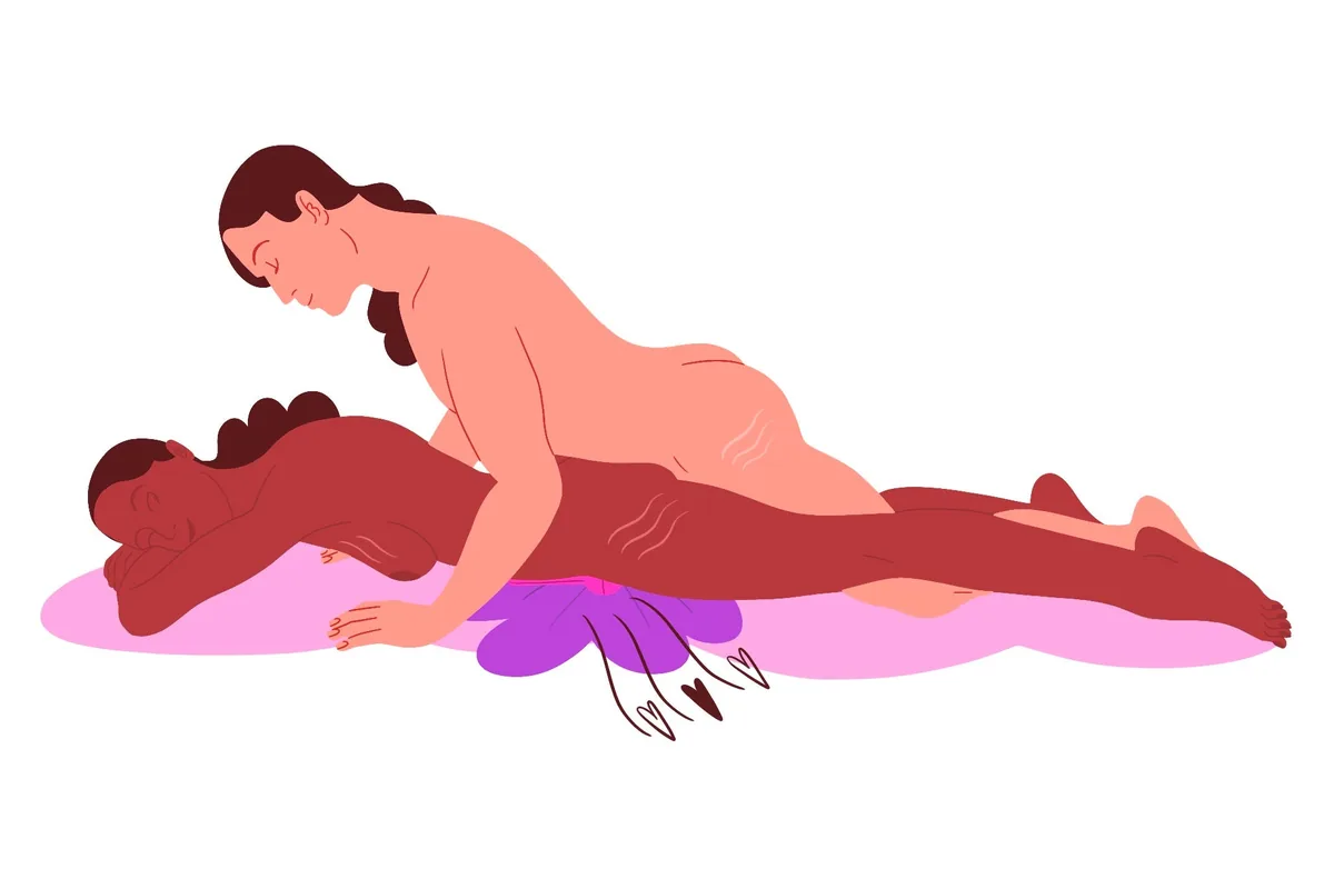 Flat illustration of the speed bump: the lower partner lies face down over a cushion that lifts the hips